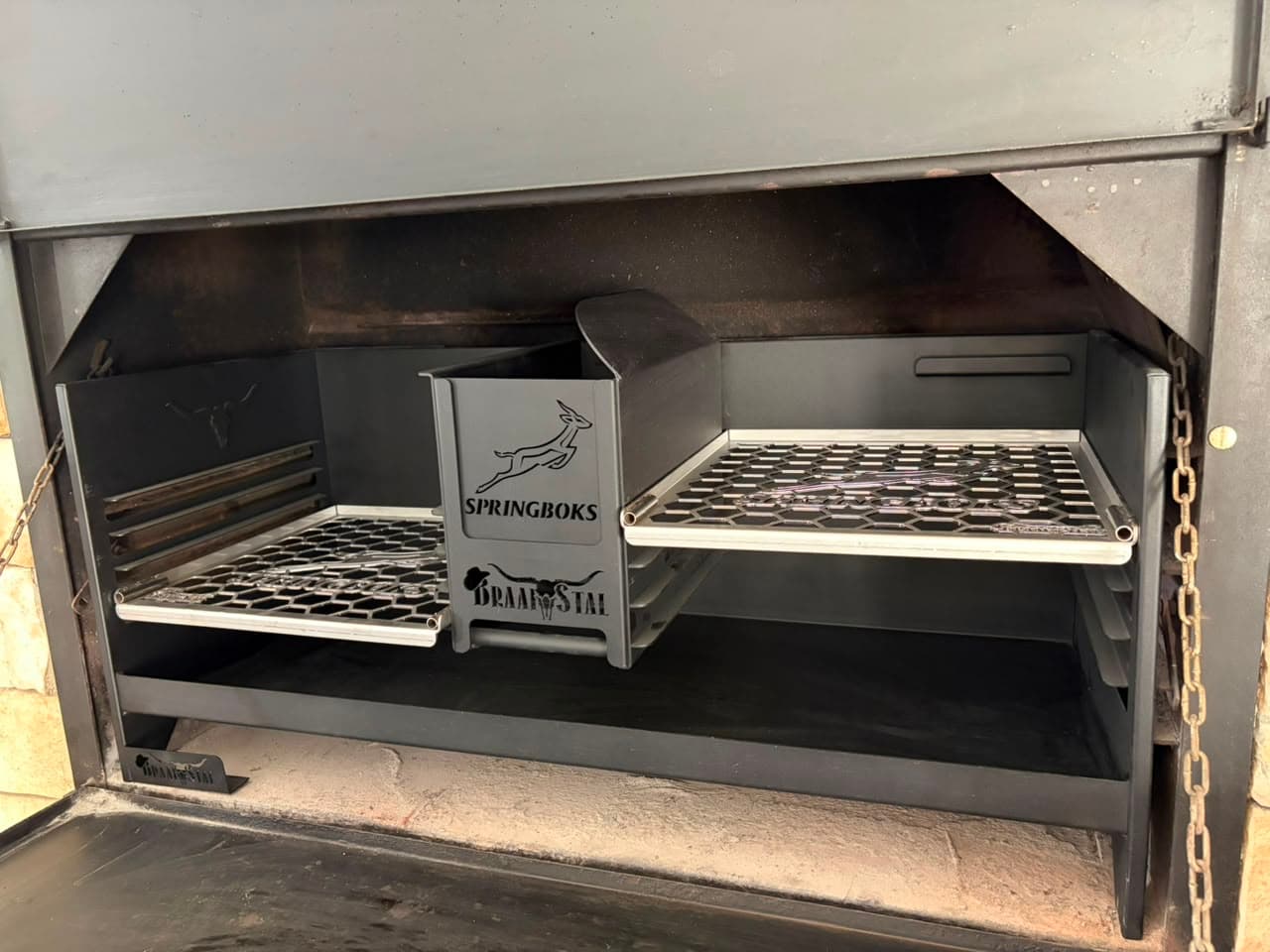 Custom BraaiStal built-in braai with adjustable grids and personalised steelwork